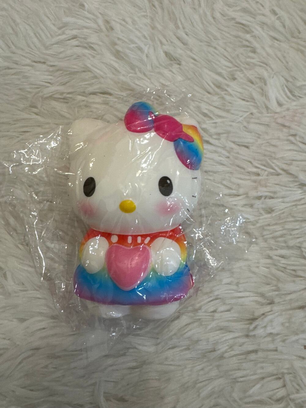 Hello Kitty rainbow foam squishy with rainbow-colored bow and heart
